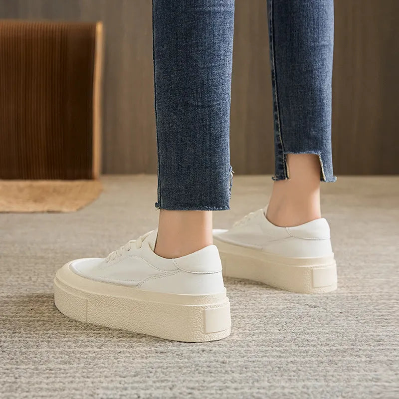 Women's black and white platform casual sports shoes with cowhide leather upper and round toe.