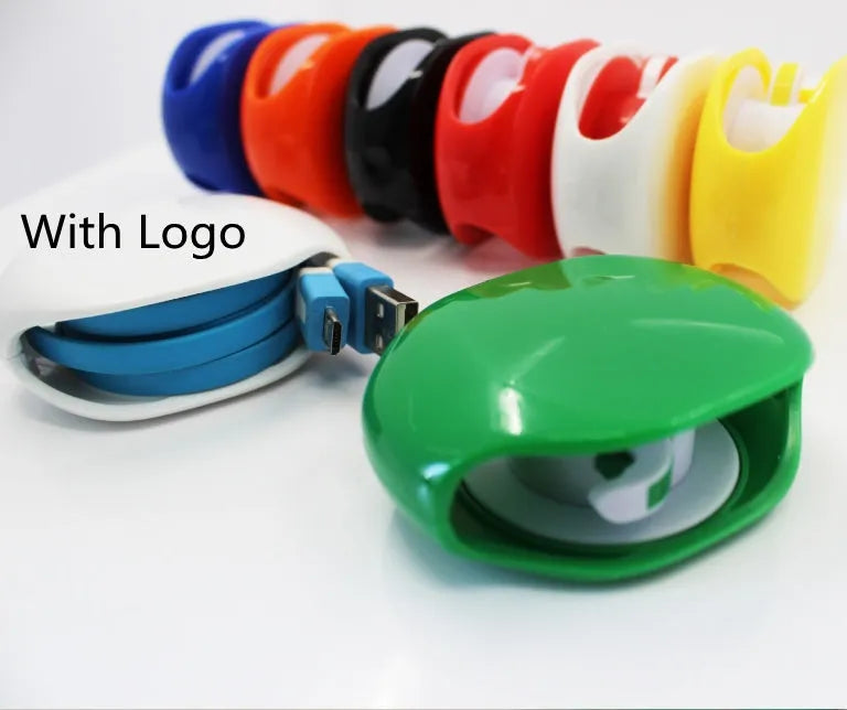 Automatic push-button earphone cable winder reel in assorted colours on a white background.