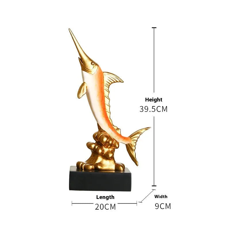 Close-up of a detailed resin European swordfish ornament in bright gold colour on a shelf.