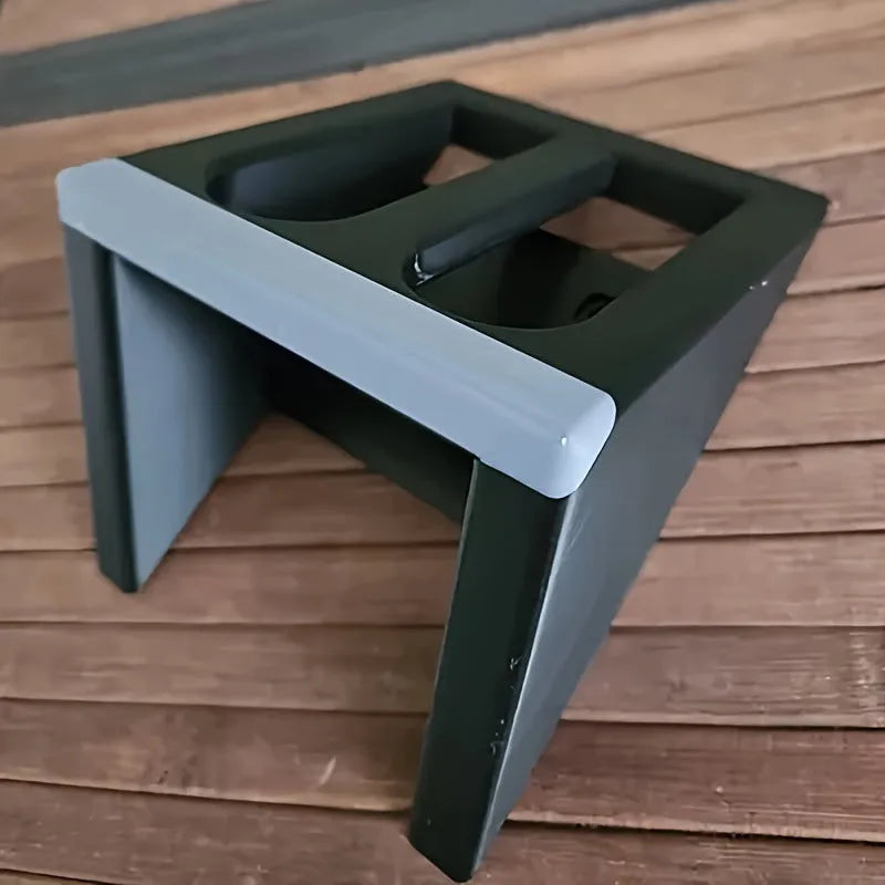 Black punk-style plastic pistol stand for handgun display measuring 10.85cm by 7.6cm