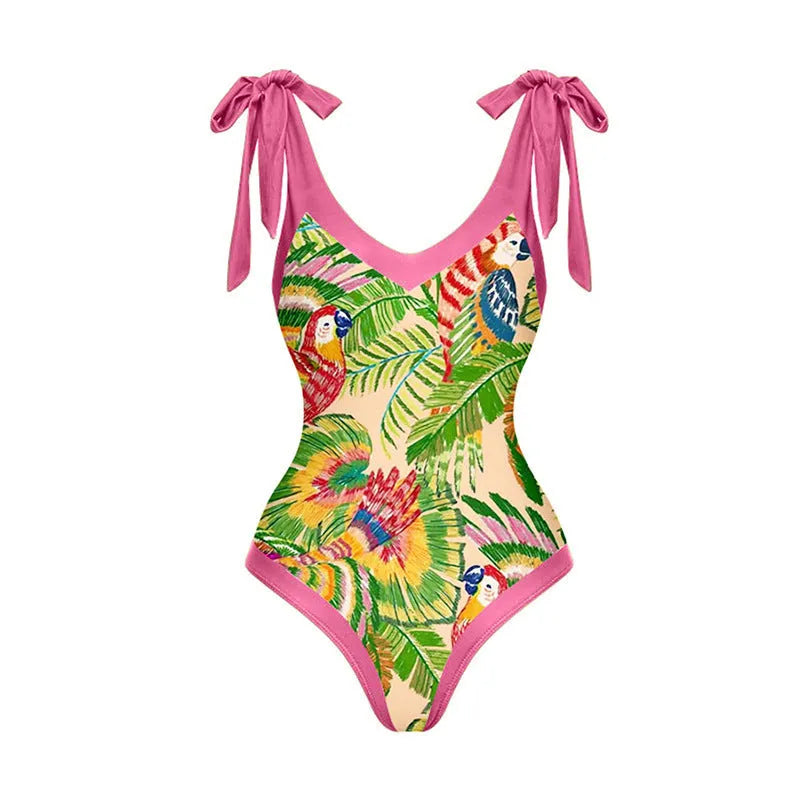 Women's pink floral print one-piece swimsuit with V-neck and a separate cover-up skirt.
