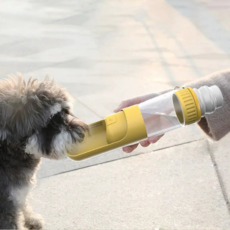 Dark blue portable dog water bottle with built-in drinking bowl, shown with leak-proof lock engaged.