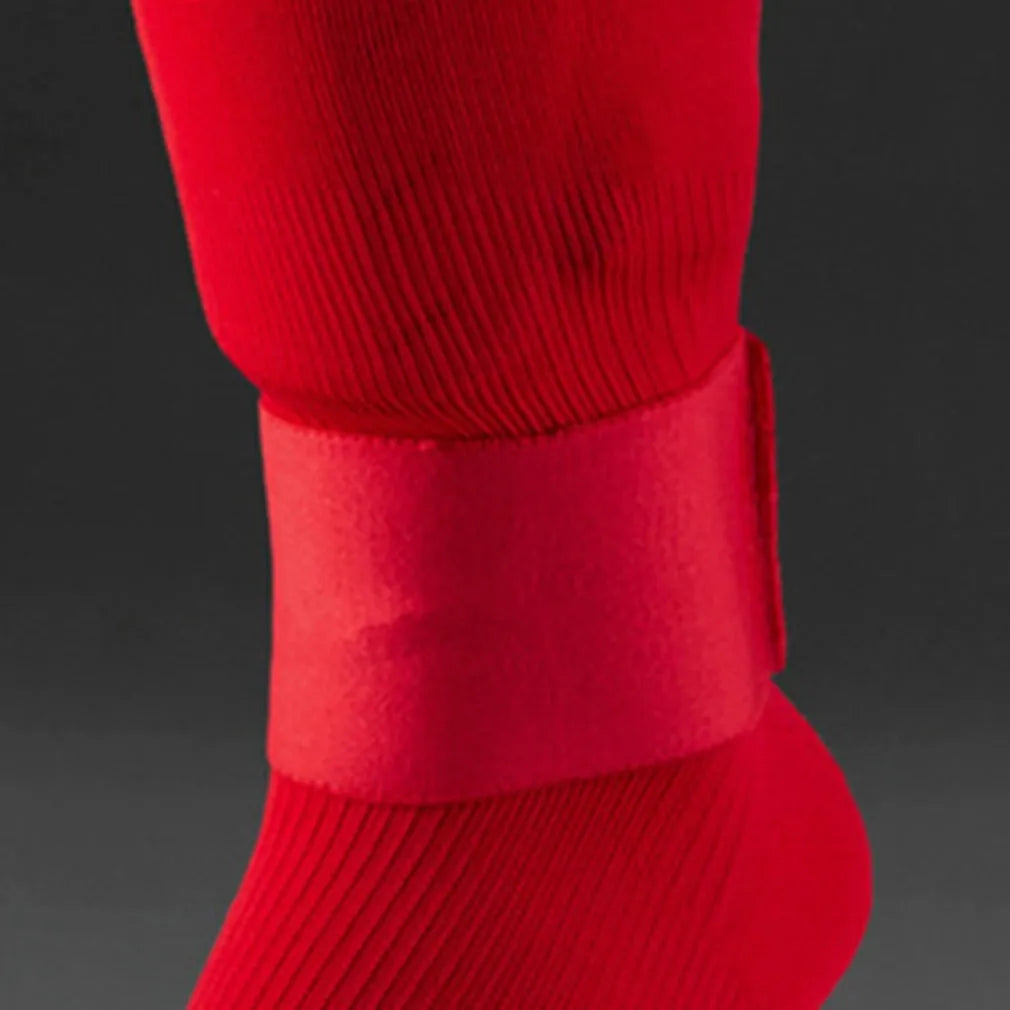 Red rubber football shin guard magic tape belt isolated on white background.