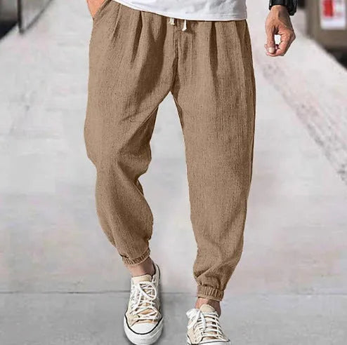 Men's loose cotton summer trousers with banded ankle cuff in light green colour