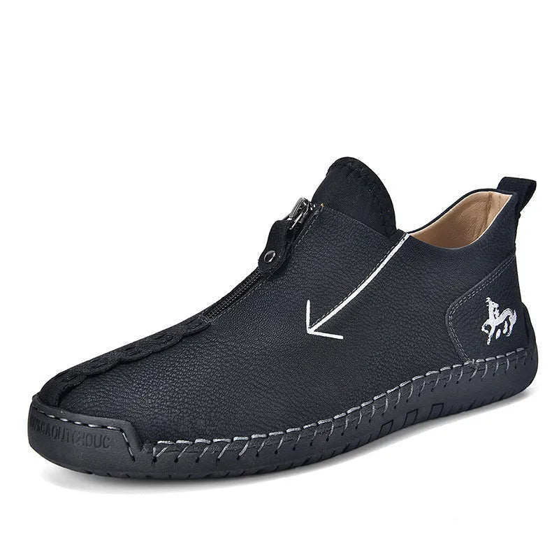 Men's black casual ankle boots with a front zip closure and visible stitching detail