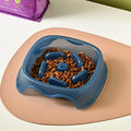 Plastic slow feeder dog bowl in blue, grey, green, and orange colour options