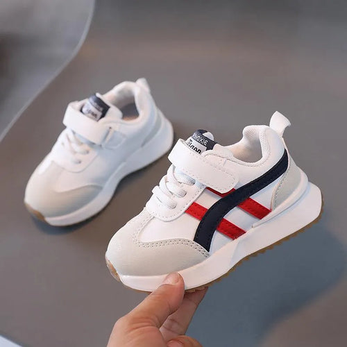 Children's white sneakers with Velcro fastening and rubber soles
