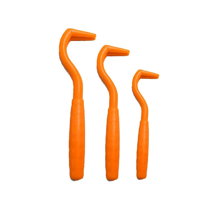 Set of three coloured ABS plastic tick removal hooks for dogs on a white background.