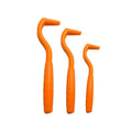 Set of three coloured ABS plastic tick removal hooks for dogs on a white background.