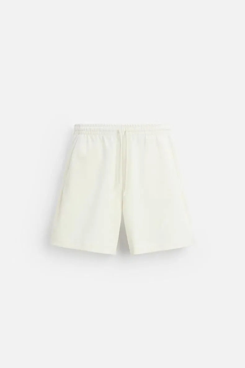 Short sleeve top and matching shorts set with double-sided cloth texture in urban style