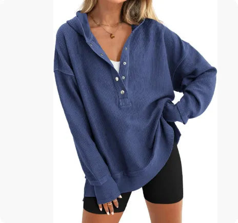 Women's loose fit peacock green raglan sleeve pullover sweater on a hanger.