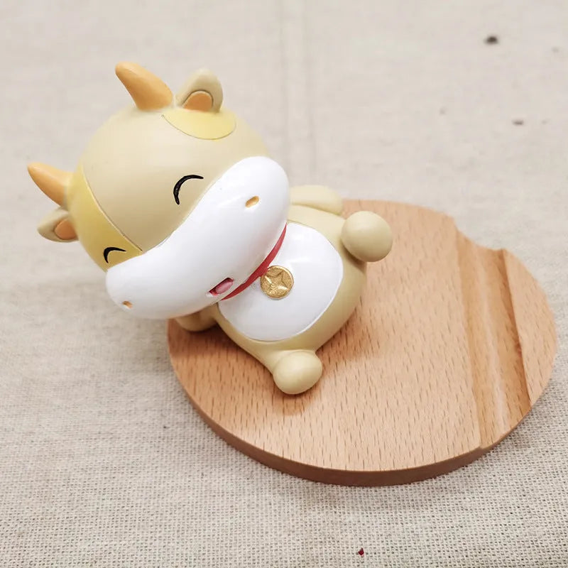 Resin mobile phone holder with beech wood animal design and coin storage compartment