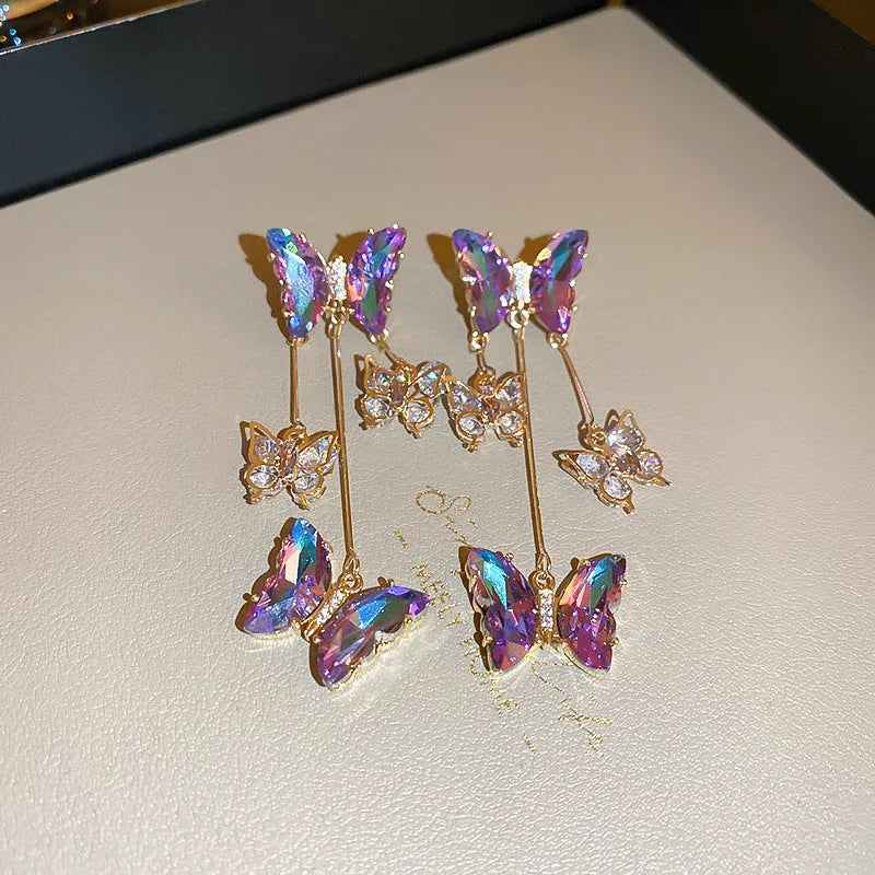 Silver needle blue purple butterfly tassel earrings with crystal flowers for women.