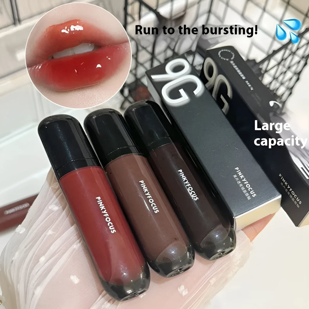 Black shiny mirror lip lacquer cosmetic product showing six colour options including deep reds and browns