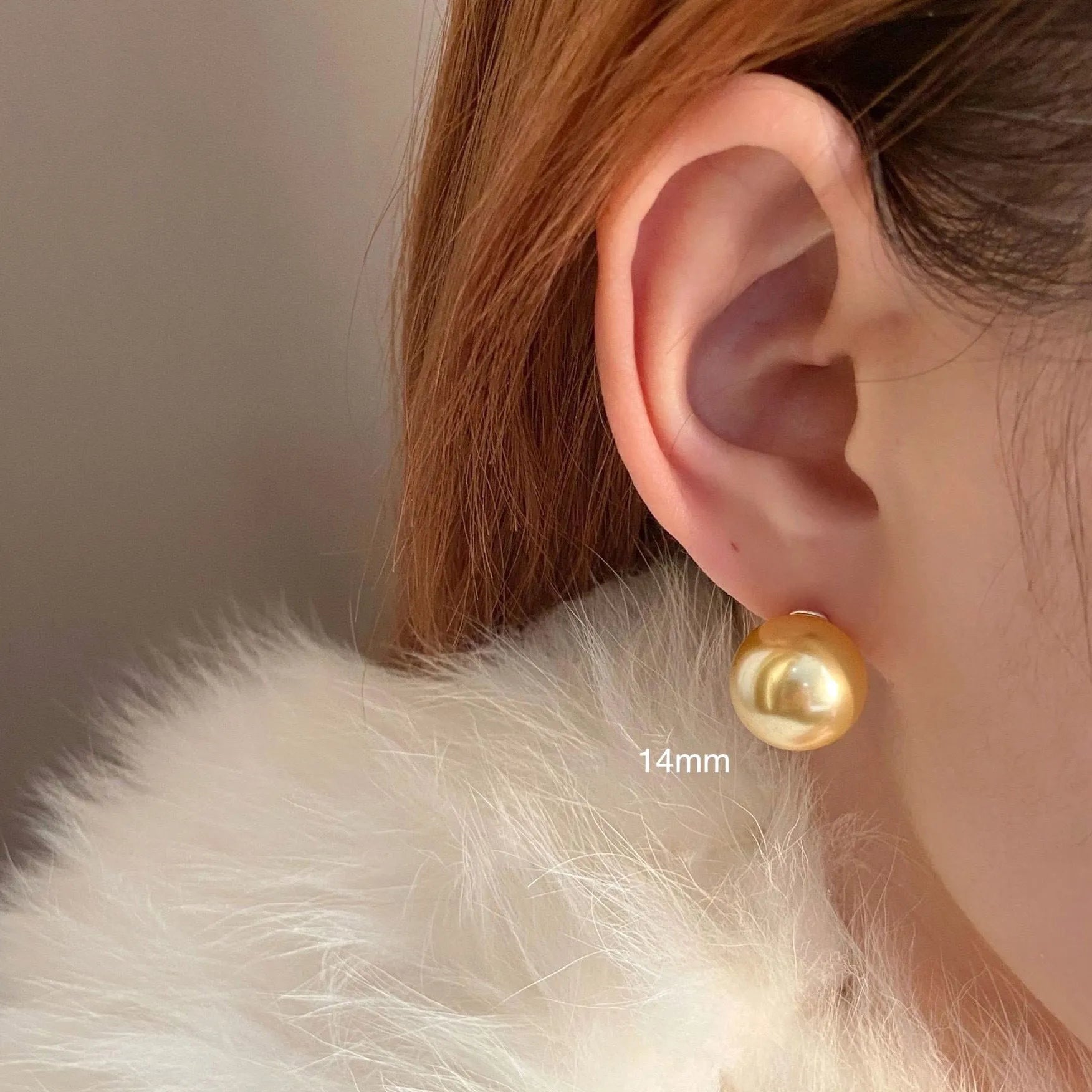 A pair of large geometric pearl stud earrings for women in silver, showing an eight-point star design detail.