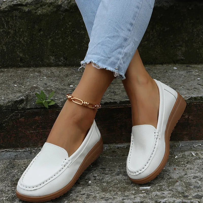 Women's flat loafer shoes in PU leather with a round toe and rubber sole, shown in multiple colours.
