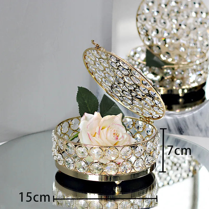 French gold metal jewellery box with a transparent crystal glass lid for storing rings and necklaces.