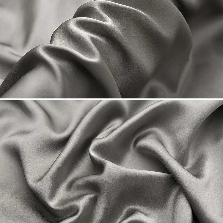 Dark grey 19 momme mulberry silk pillowcase with an envelope closure, laid flat.