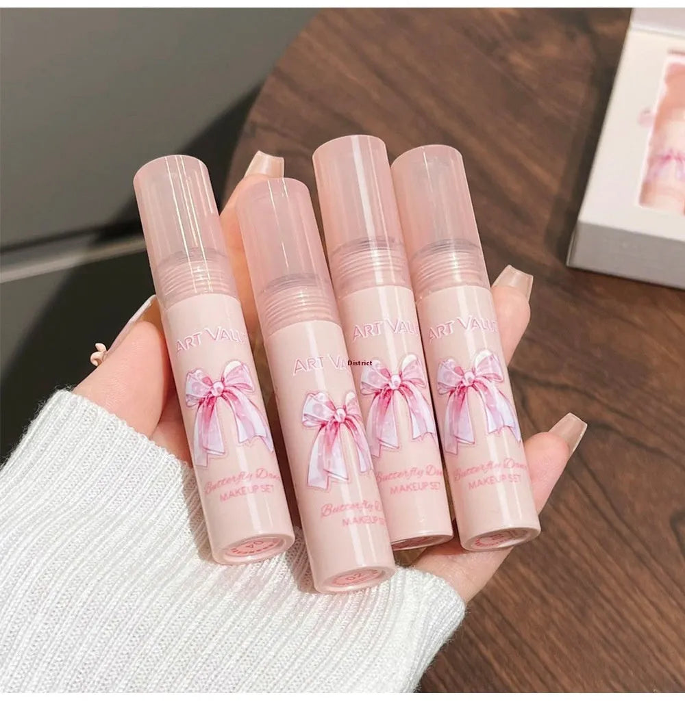 Butterfly Box makeup collection showing pink lip muds, powder blusher and matching necklace