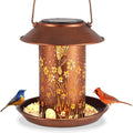 Solar-powered iron art bird feeder lamp with hummingbird pattern for outdoor gardens.