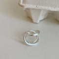 Geometric interlaced matte metal open ring for women in gold or silver.