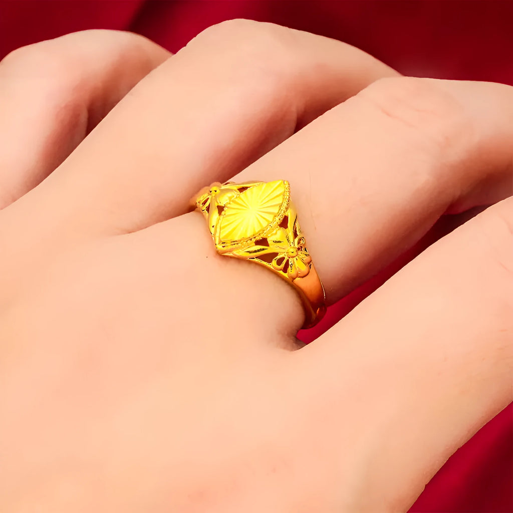 Gold geometric ring with open diamond floral pattern and textured surface