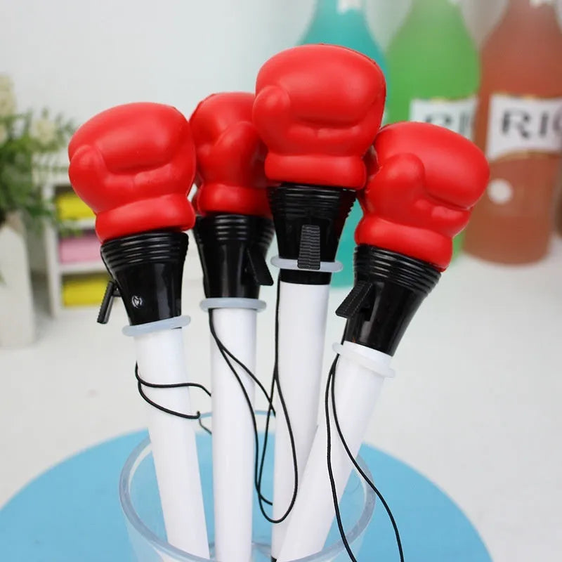 Boxing press ejection pen set showing four pens with plug-in sleeve mechanism and 0.7mm bullet-shaped tips