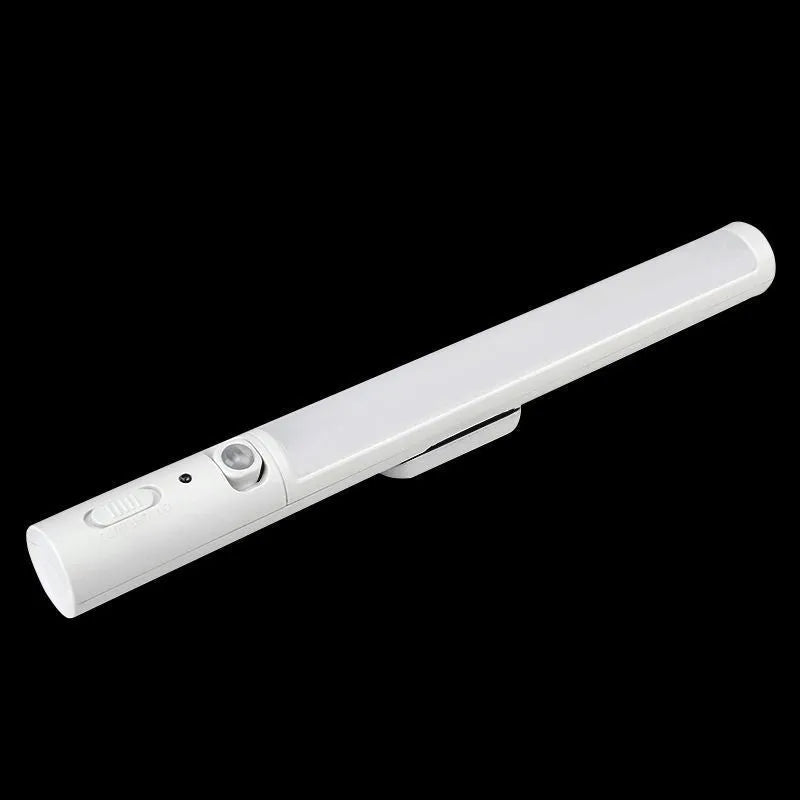 A slim 260mm long white LED strip light with a magnetic back for cabinet mounting.