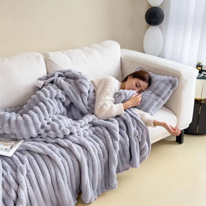Soft Wind double-sided thickening bubble velvet blanket in a solid colour shown on a sofa.