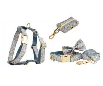 Blue floral pattern dog collar set with matching accessories including bow, leash and vest