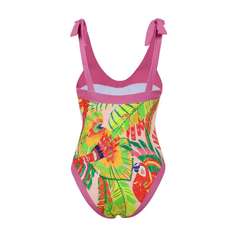 Women's pink floral print one-piece swimsuit with V-neck and a separate cover-up skirt.