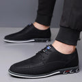 Men's casual leather shoes in black with rubber sole, leather toe cap, and stitching detail.