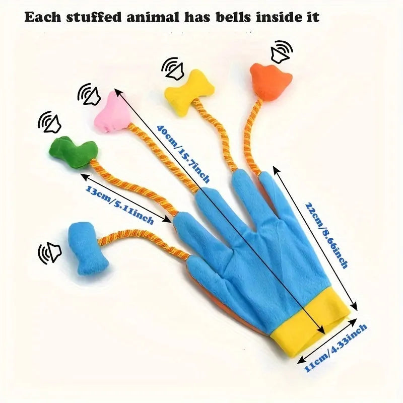 Yellow and blue plush cat toy shaped like a glove with a bell, shown on a scale indicating 52g weight.