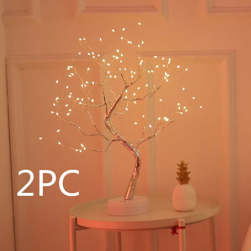 White LED Christmas tree shaped night light with touch base, standing 50cm tall on a table.