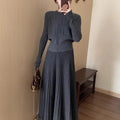 Women's dark grey knitted two-piece suit with artistic collage stitching and retro ethnic style.