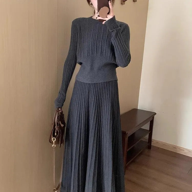 Women's dark grey knitted two-piece suit with artistic collage stitching and retro ethnic style.