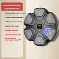 Smart electronic boxing target mounted on a wall, with black and white boxing gloves for reaction training.