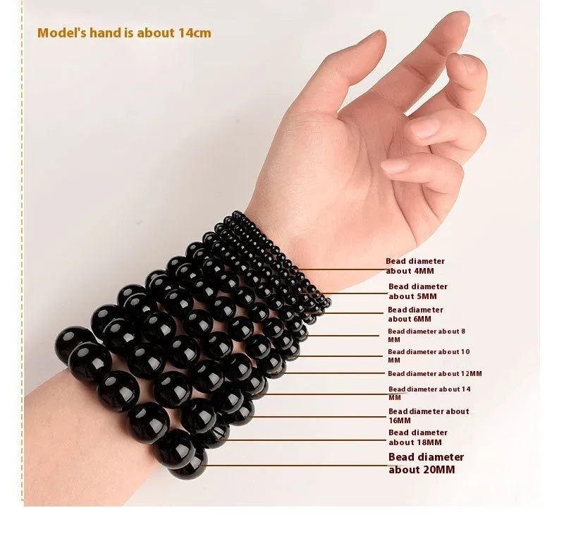 Straight cut smokey violet Hetian jade bead bracelet on a wrist, showing unisex casual style.