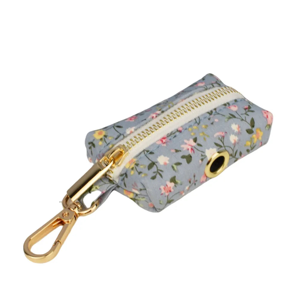 Blue floral pattern dog collar set with matching accessories including bow, leash and vest