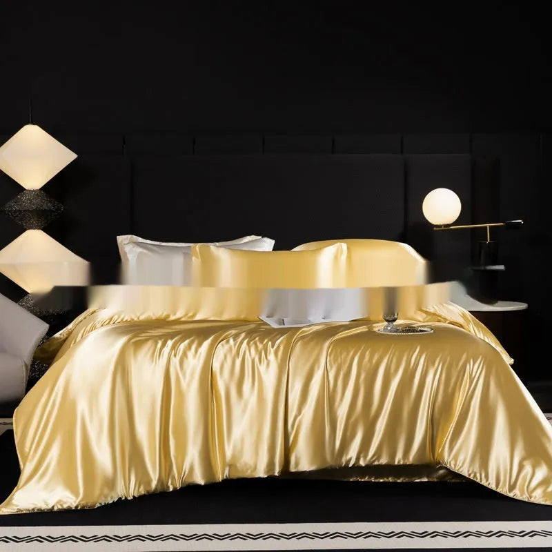 Solid colour silk bedding four-piece set shown in twilight blue on a bed.