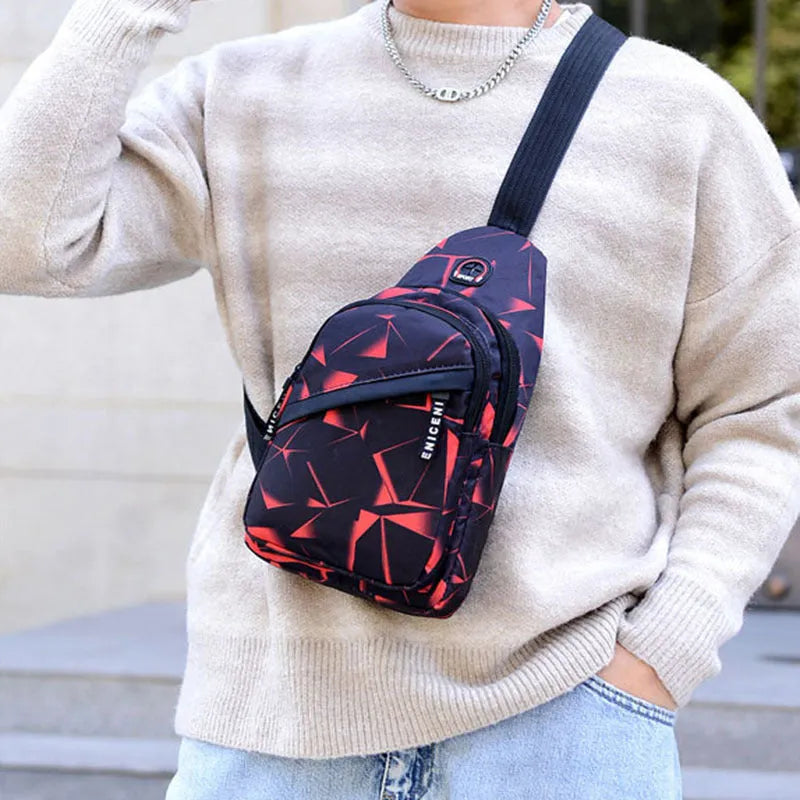 Men's Oxford cloth sling chest bag with earphone hole showing crossbody strap and zipper closure