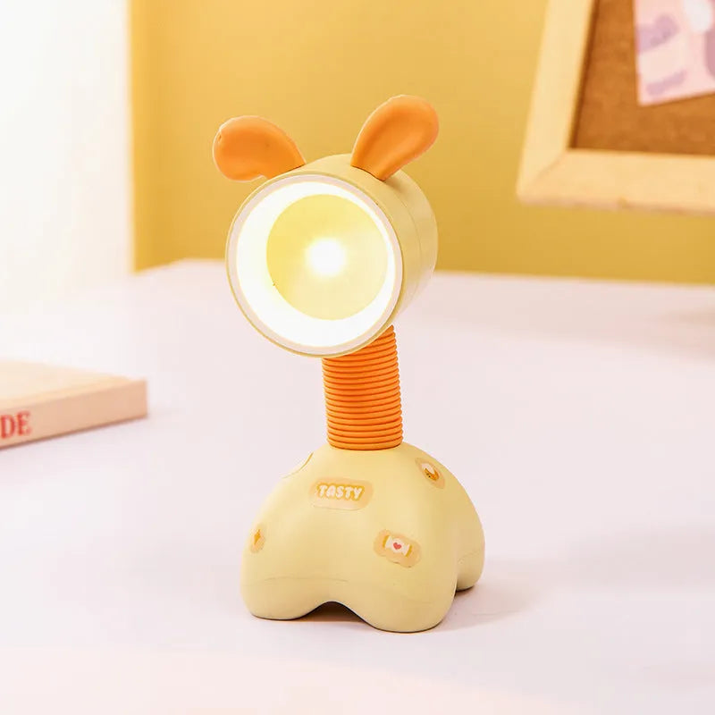 DIY cartoon animal magnetic night lamp in assorted colours on a desk, with adjustable lamp head.