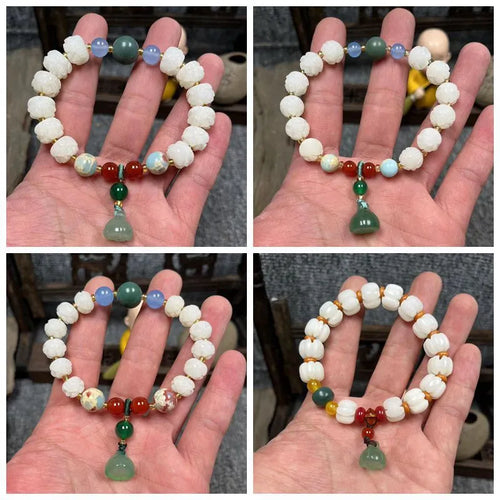 Carved pumpkin lotus bodhi root bracelet with white jade segments and golden silk jade treasures