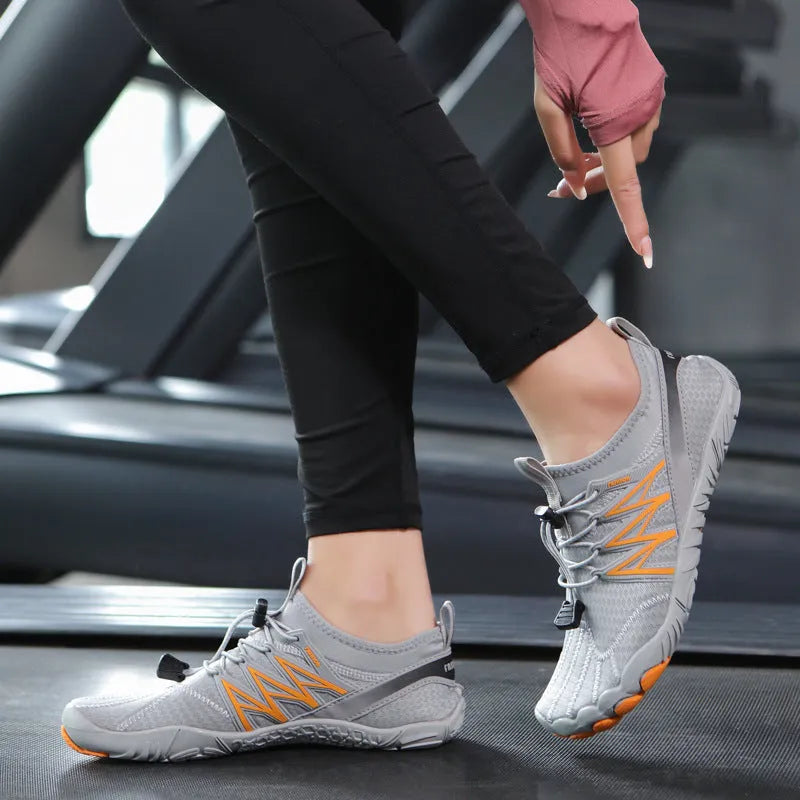 Lightweight striped training sneakers with a mesh upper and non-slip rubber sole in multiple colour options.