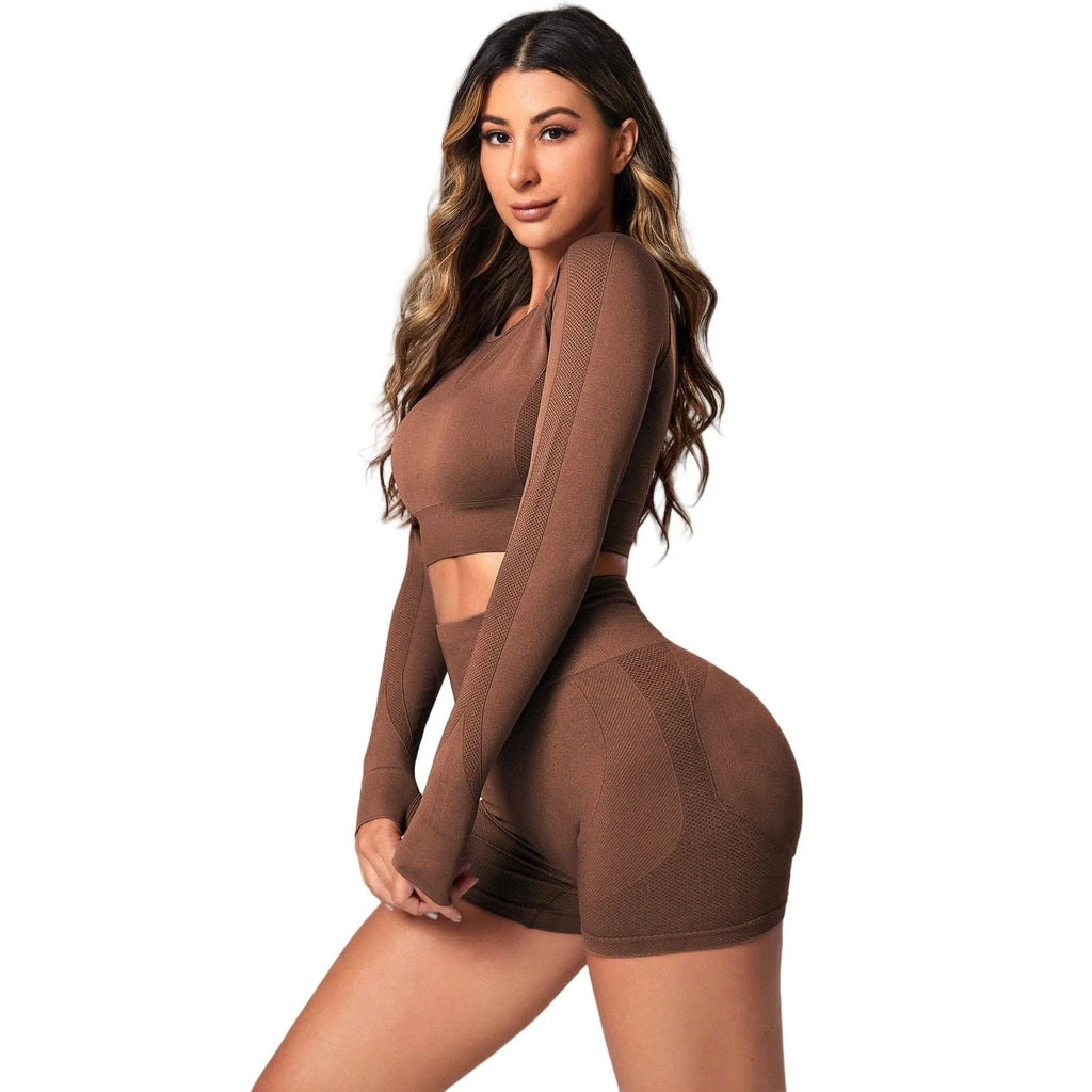Women's black yoga suit set with long sleeve top and high-waisted tights on a mannequin.