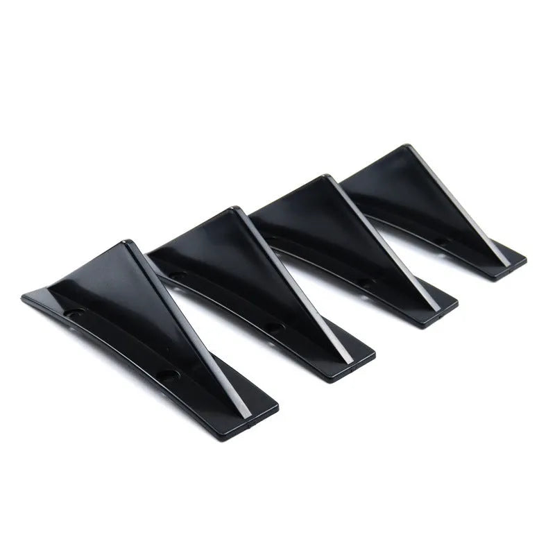 Set of four black ABS plastic triangle rear spoilers for car bumper, measuring 15cm wide, with screws and adhesive tape.