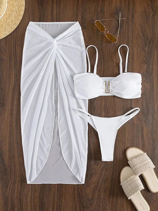 Women's multicolour French-style three-piece bikini set with a long culotte skirt on a hanger.