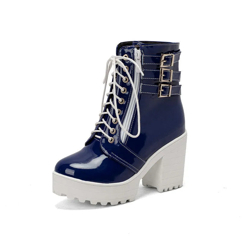 Women's black ankle boots with thick heel, round toe, and front lace-up on a waterproof platform sole.