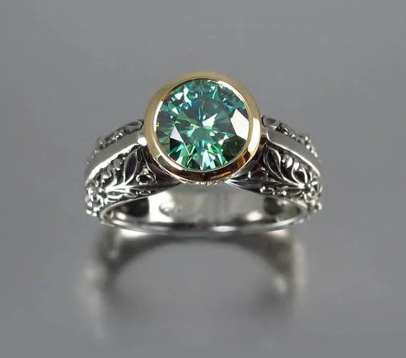 Vintage flower-shaped gemstone ring with gold plating and green silver colour finish showing colour separation design detail