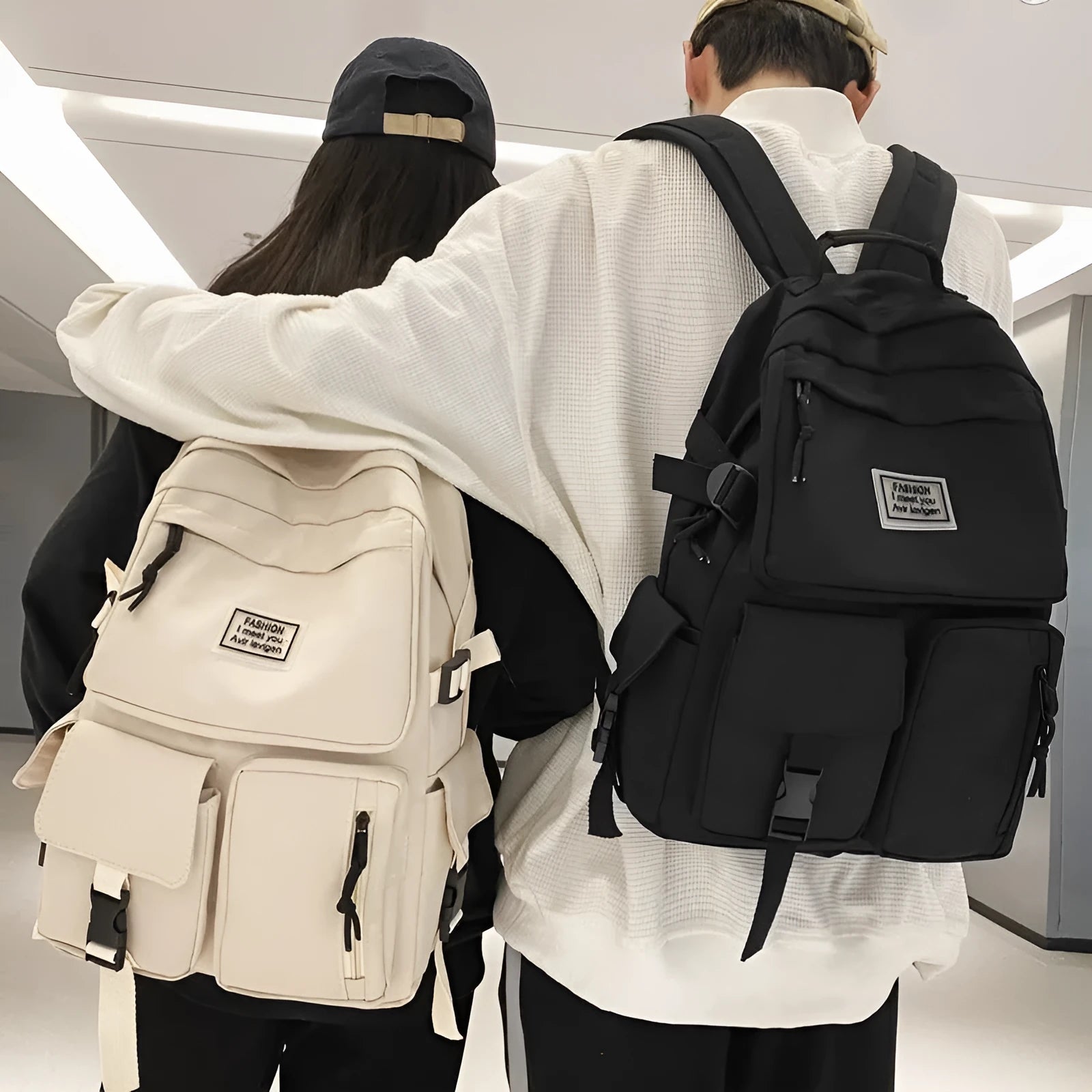 Soft nylon student backpack in black or white with computer compartment and three-dimensional pockets